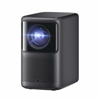 Compact black projector with illuminated lens.