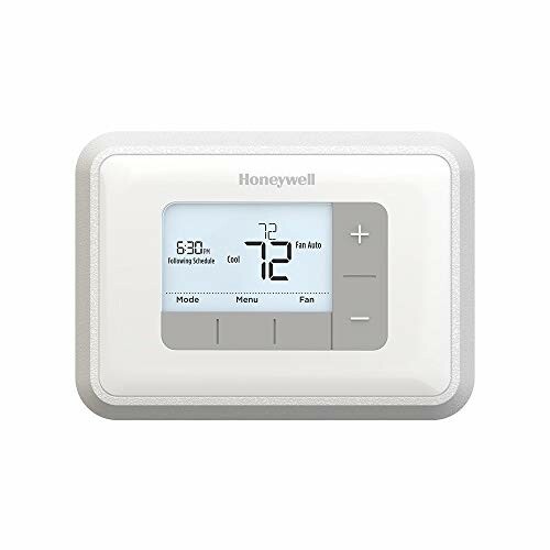 Honeywell digital thermostat with display showing temperature.