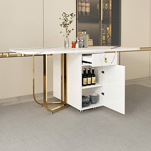 Modern kitchen island with storage and gold accents.