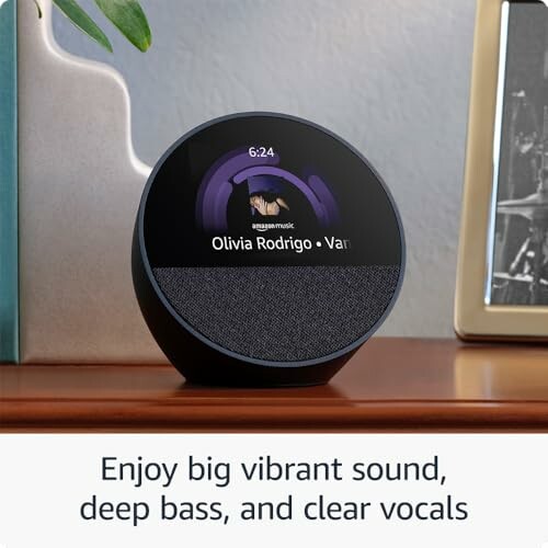 Smart speaker with display showing music by Olivia Rodrigo.