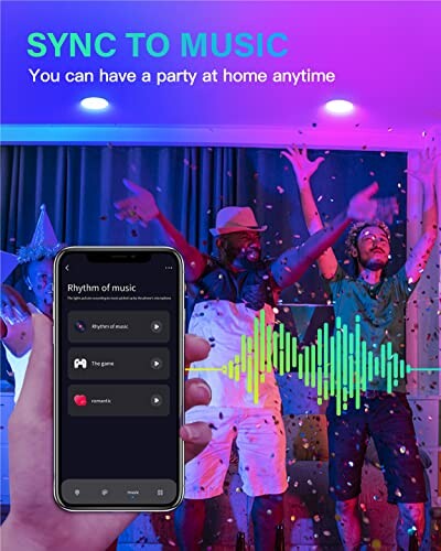 People dancing at a party with music synchronization app on a smartphone.